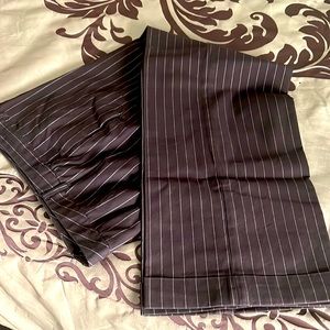 Brown pin-striped slacks.